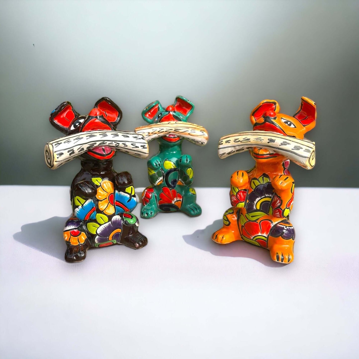 Talavera Dog Holding Newspaper Statue | Colorful Mexican Garden Art